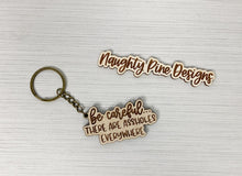 Load image into Gallery viewer, Be Careful There Are Assholes Everywhere | Keychain | Acrylic or Wood

